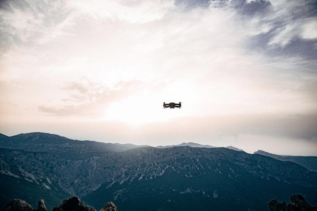 drone flying over mountains