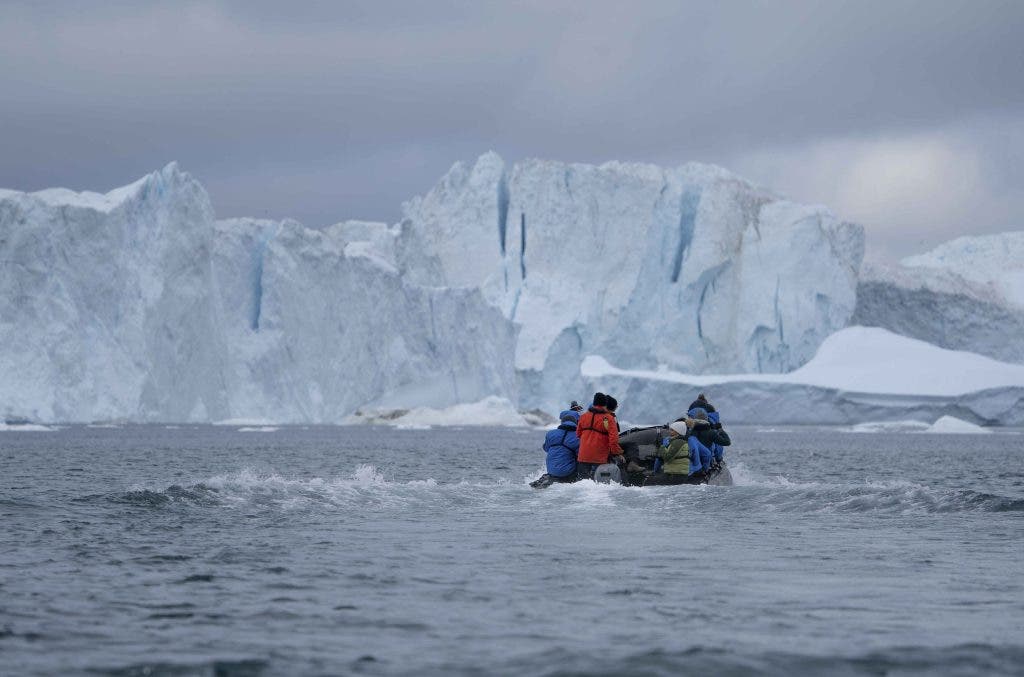 Zodiacs heading to the Iluissat Icefjord_ Greenland Photography _ BY Stephanie Vermillion