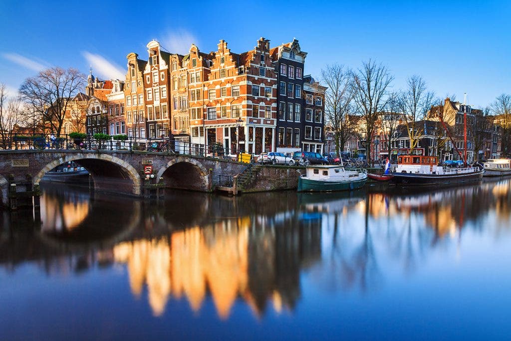 Beautiful image of the UNESCO world heritage canals the 'Brouwersgracht' en 'Prinsengracht (Prince's canal)' in Amsterdam, the Netherlands by  dennisvdwater