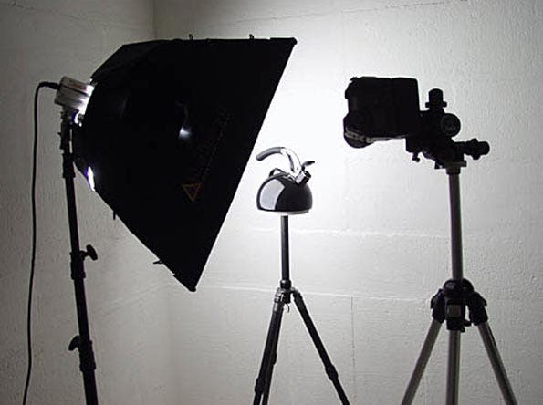 Tea kettle on tripod lit by larger modifier.